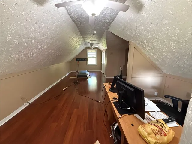 a bed room with a bed and a chair