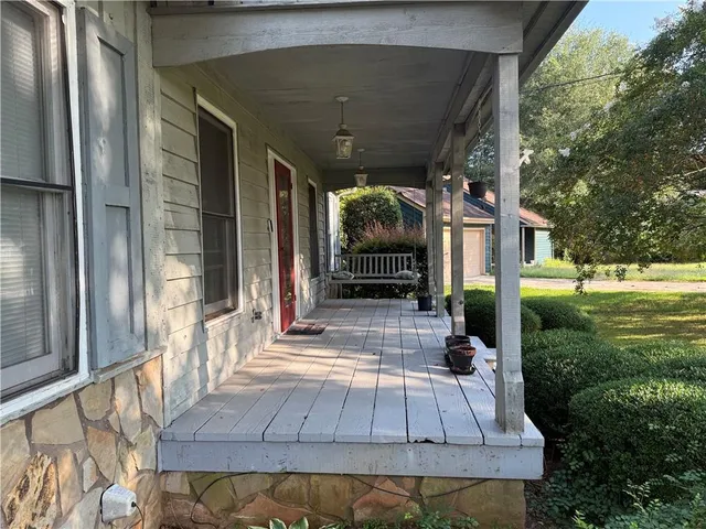 a kitchen with stainless steel appliances a refrigerator sink and cabinets