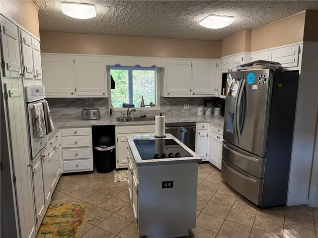 a living room with furniture fireplace and a window