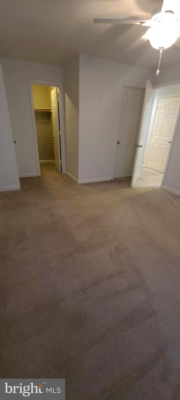 20958 Timber Ridge Terrace, Unit 201 Ashburn, VA 20147 - Photo 16 of 20 Primary bedroom with walk in closet