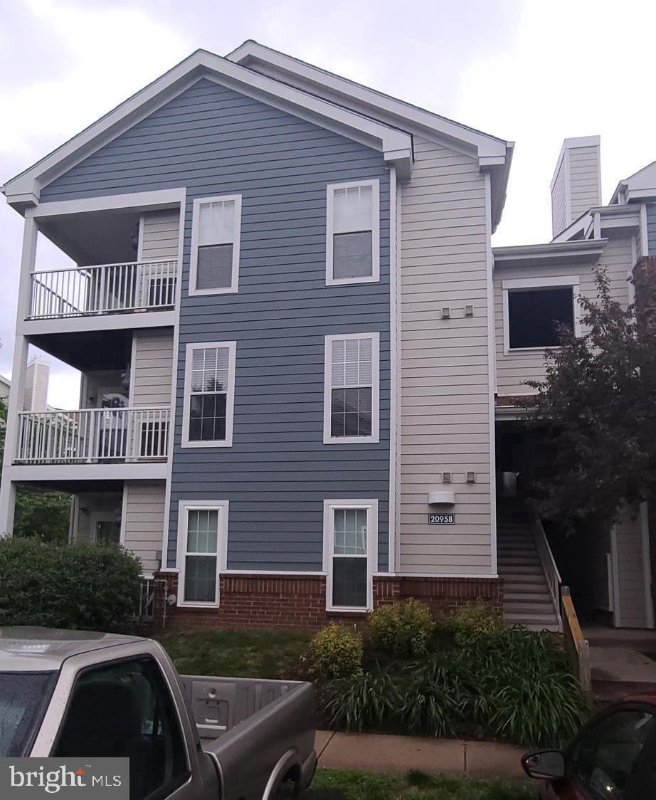 20958 Timber Ridge Terrace, Unit 201 Ashburn, VA 20147 - Photo 3 of 20 parking near entry