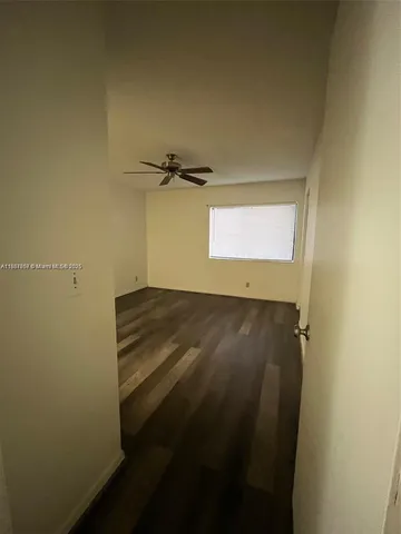 a bathroom with a double vanity sink a mirror and a toilet
