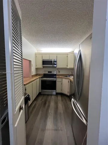 a bathroom with a sink and washing machine