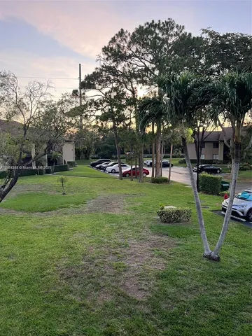 a view of a park with swings and slides