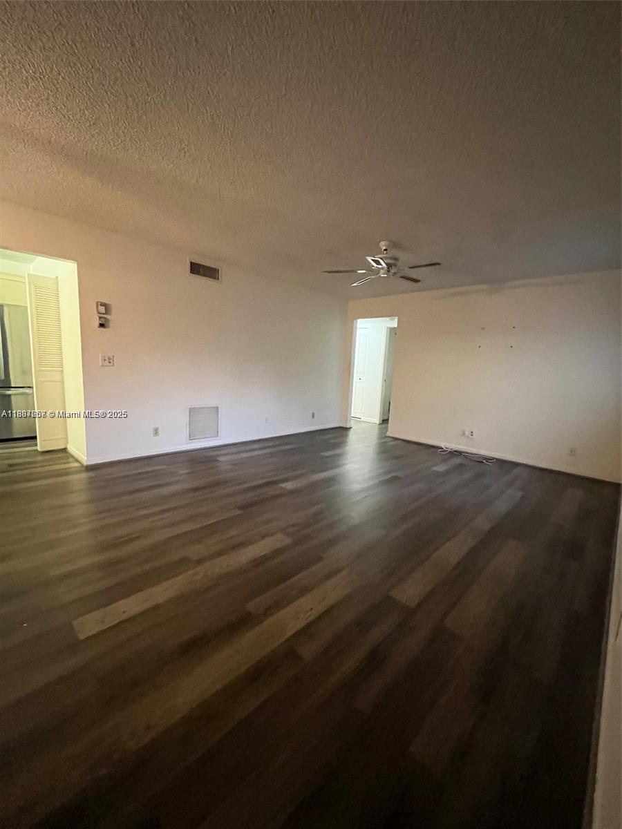 512 Shady Pine Way, Unit D2 Greenacres, FL 33415 - Photo 6 of 16 wooden floor in an empty room