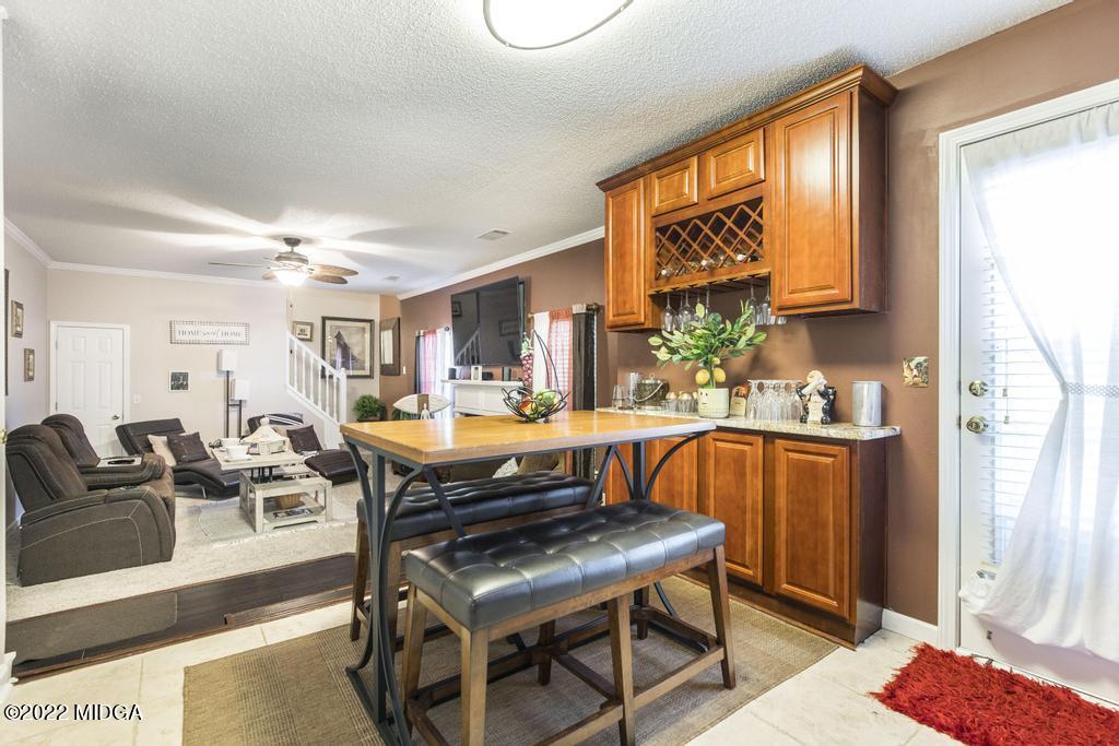 825 Kohl Drive McDonough, GA 30253 - Photo 15 of 59 a living room with furniture a rug and a window