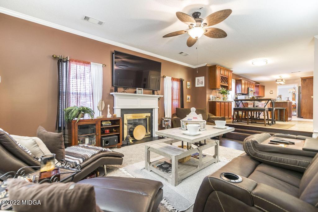 825 Kohl Drive McDonough, GA 30253 - Photo 18 of 59 a living room with furniture fireplace and a flat screen tv