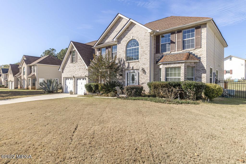 825 Kohl Drive McDonough, GA 30253 - Photo 3 of 59 a front view of a house with a yard