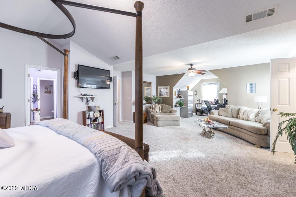 825 Kohl Drive McDonough, GA 30253 - Photo 35 of 59 a view of a livingroom with furniture and a flat screen tv
