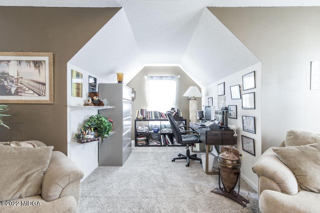 825 Kohl Drive McDonough, GA 30253 - Photo 37 of 59 a living room with furniture and a large window