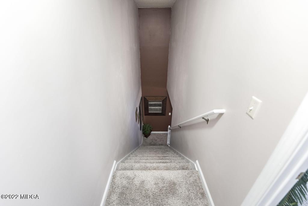 825 Kohl Drive McDonough, GA 30253 - Photo 38 of 59 a view of a hallway with stairs
