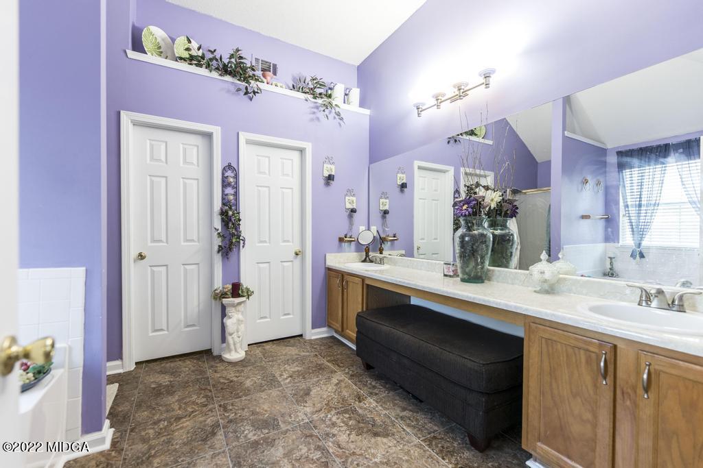 825 Kohl Drive McDonough, GA 30253 - Photo 39 of 59 a bathroom with a sink vanity and a mirror