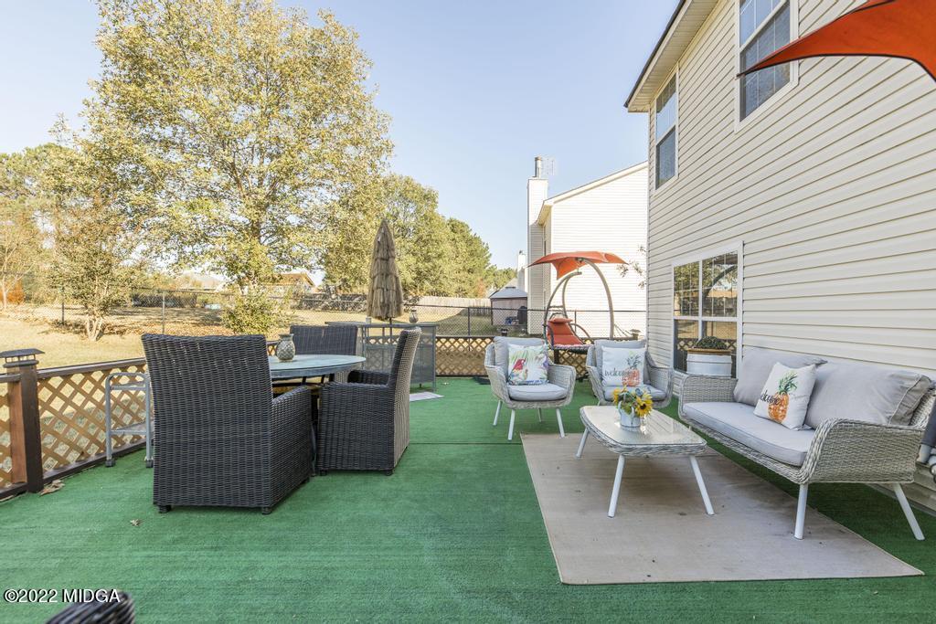 825 Kohl Drive McDonough, GA 30253 - Photo 45 of 59 a view of a chairs and table in backyard
