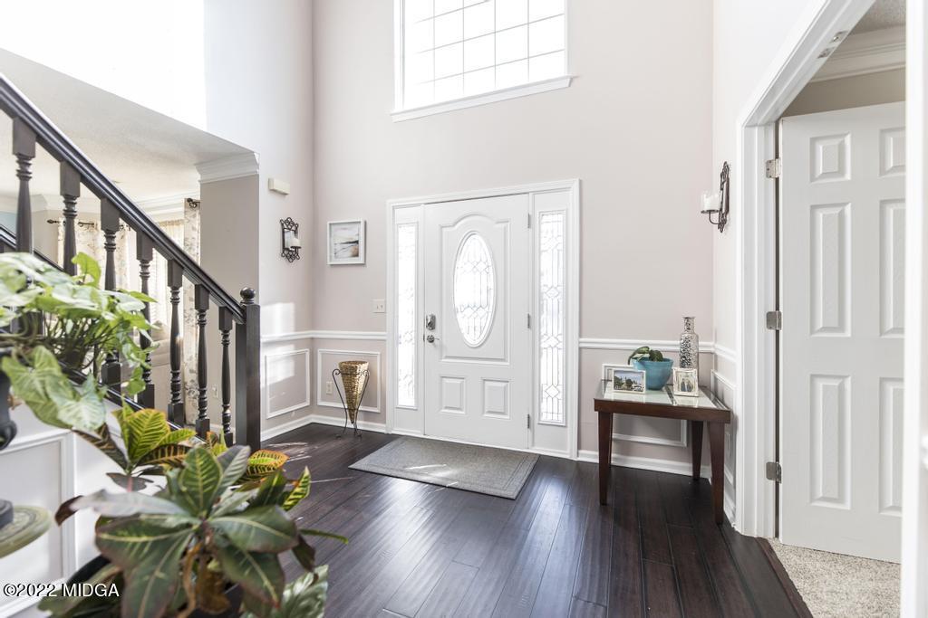 825 Kohl Drive McDonough, GA 30253 - Photo 5 of 59 a view of an entryway with wooden floor and front door