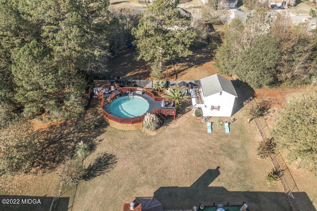 825 Kohl Drive McDonough, GA 30253 - Photo 58 of 59 a view of a backyard with a table and chairs
