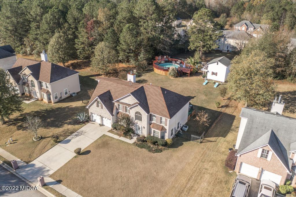 825 Kohl Drive McDonough, GA 30253 - Photo 59 of 59 an aerial view of a house with a yard and parking