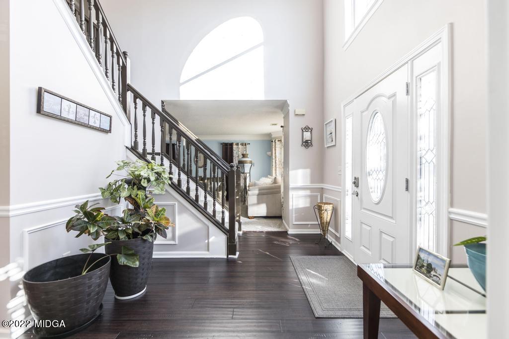 825 Kohl Drive McDonough, GA 30253 - Photo 6 of 59 a living room with furniture and wooden floor