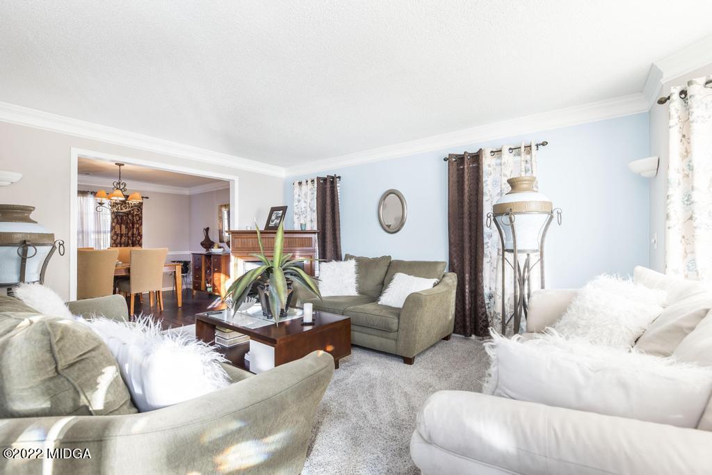 825 Kohl Drive McDonough, GA 30253 - Photo 7 of 59 a living room with furniture and a wooden floor