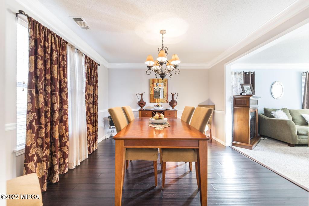 825 Kohl Drive McDonough, GA 30253 - Photo 9 of 59 a dining room with furniture and wooden floor