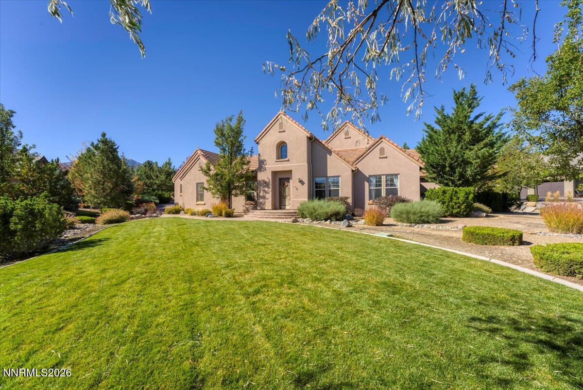 a front view of a house with a yard