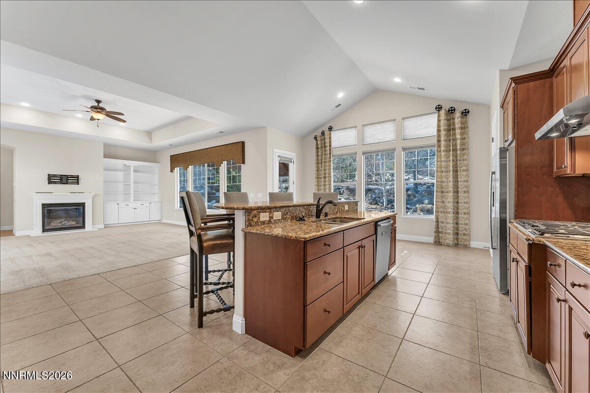 16920 Delacroix Reno, NV 89511 - Photo 14 of 25 a kitchen with stainless steel appliances granite countertop a stove and a refrigerator