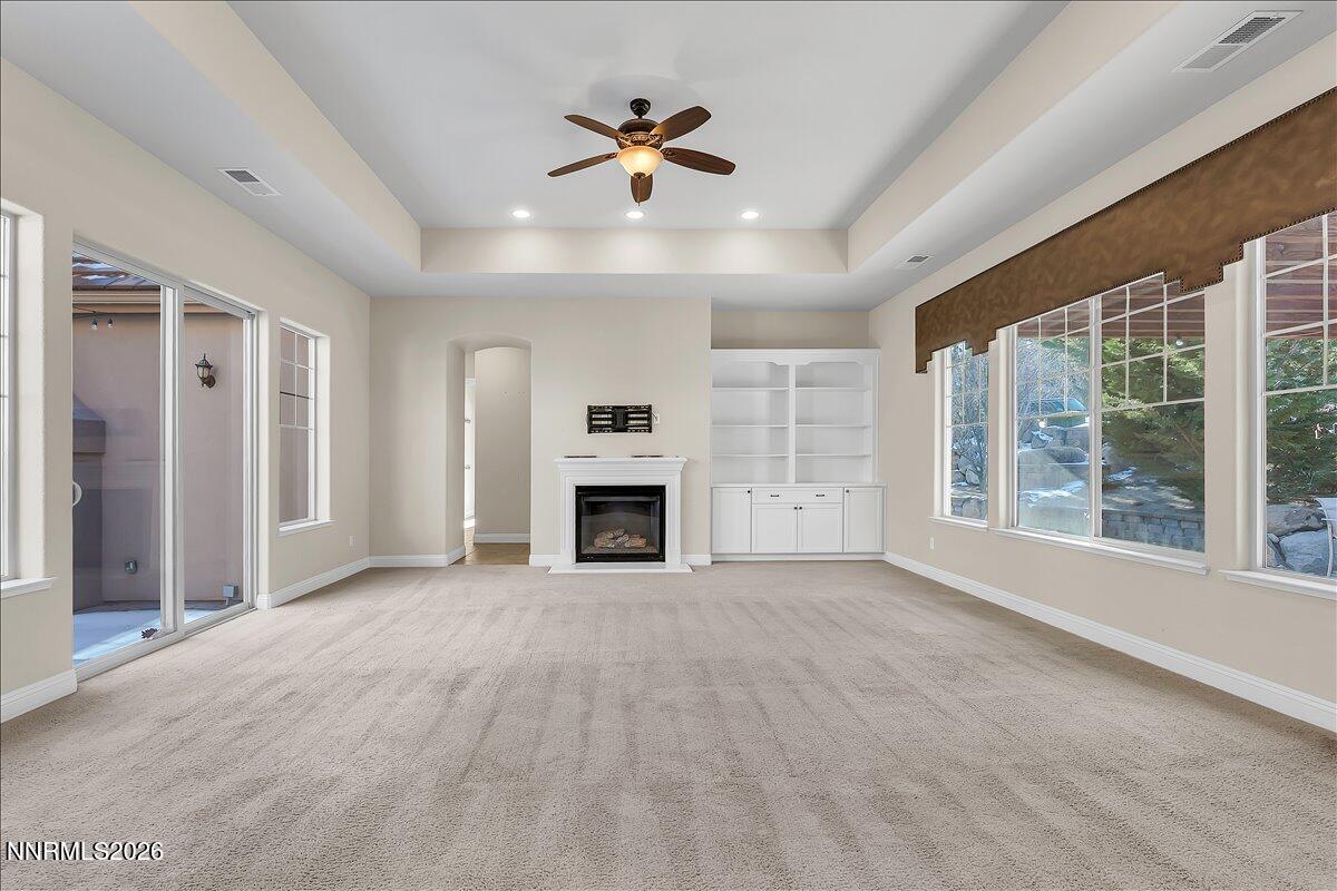 16920 Delacroix Reno, NV 89511 - Photo 15 of 25 a view of an empty room with a fireplace and a window