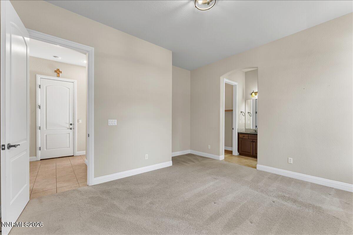 16920 Delacroix Reno, NV 89511 - Photo 21 of 25 an empty room with windows and bathroom view