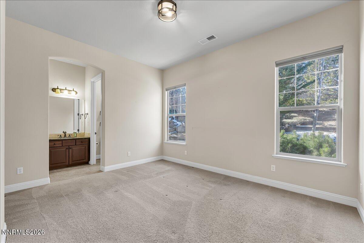 16920 Delacroix Reno, NV 89511 - Photo 23 of 25 an empty room with windows and closet
