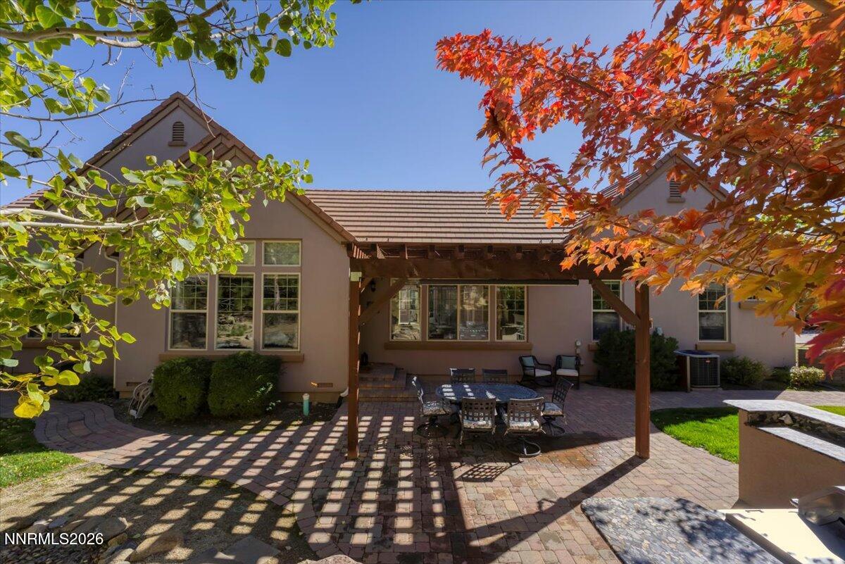 16920 Delacroix Reno, NV 89511 - Photo 3 of 25 a view of a house with backyard sitting area and garden