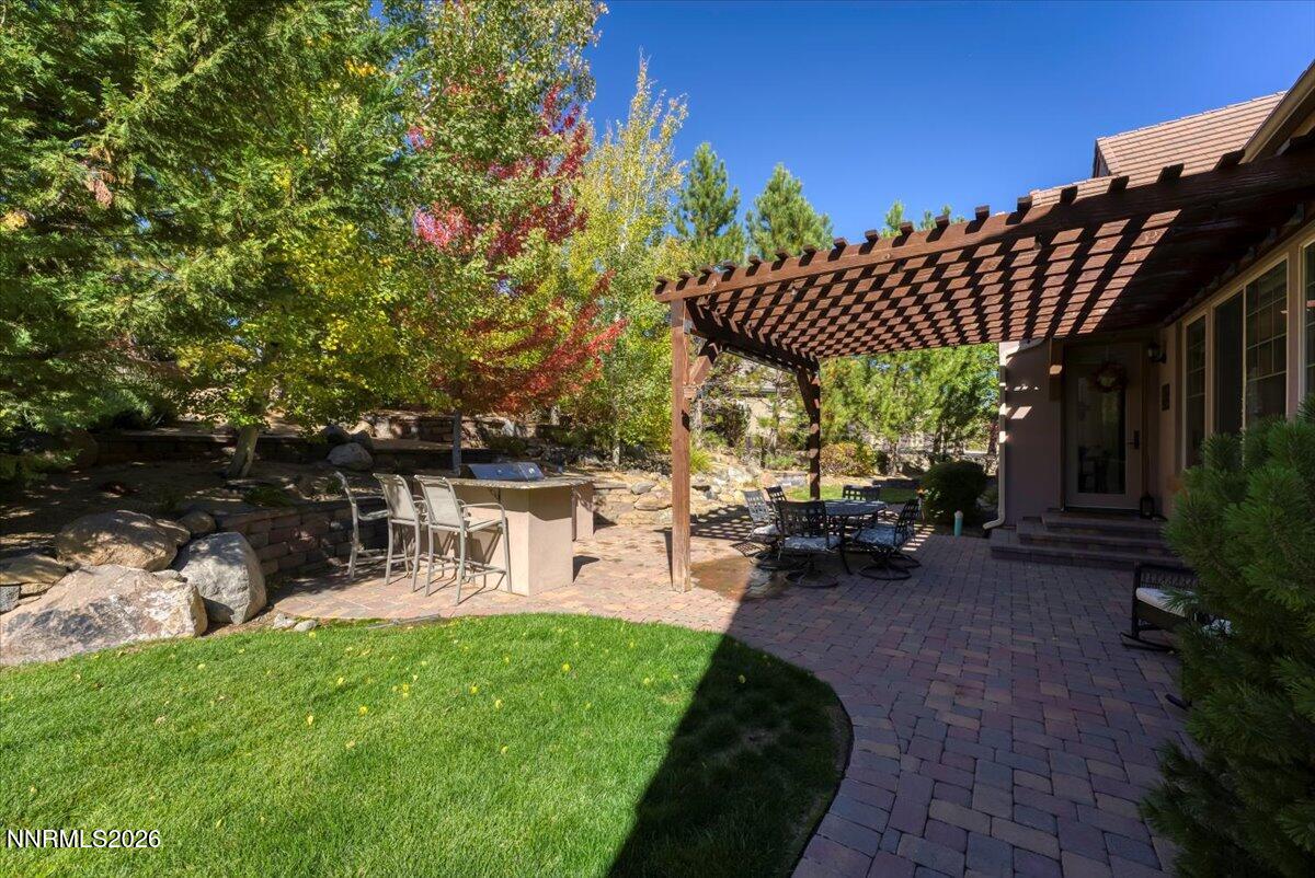 16920 Delacroix Reno, NV 89511 - Photo 4 of 25 a view of a patio with table and chairs and potted plants