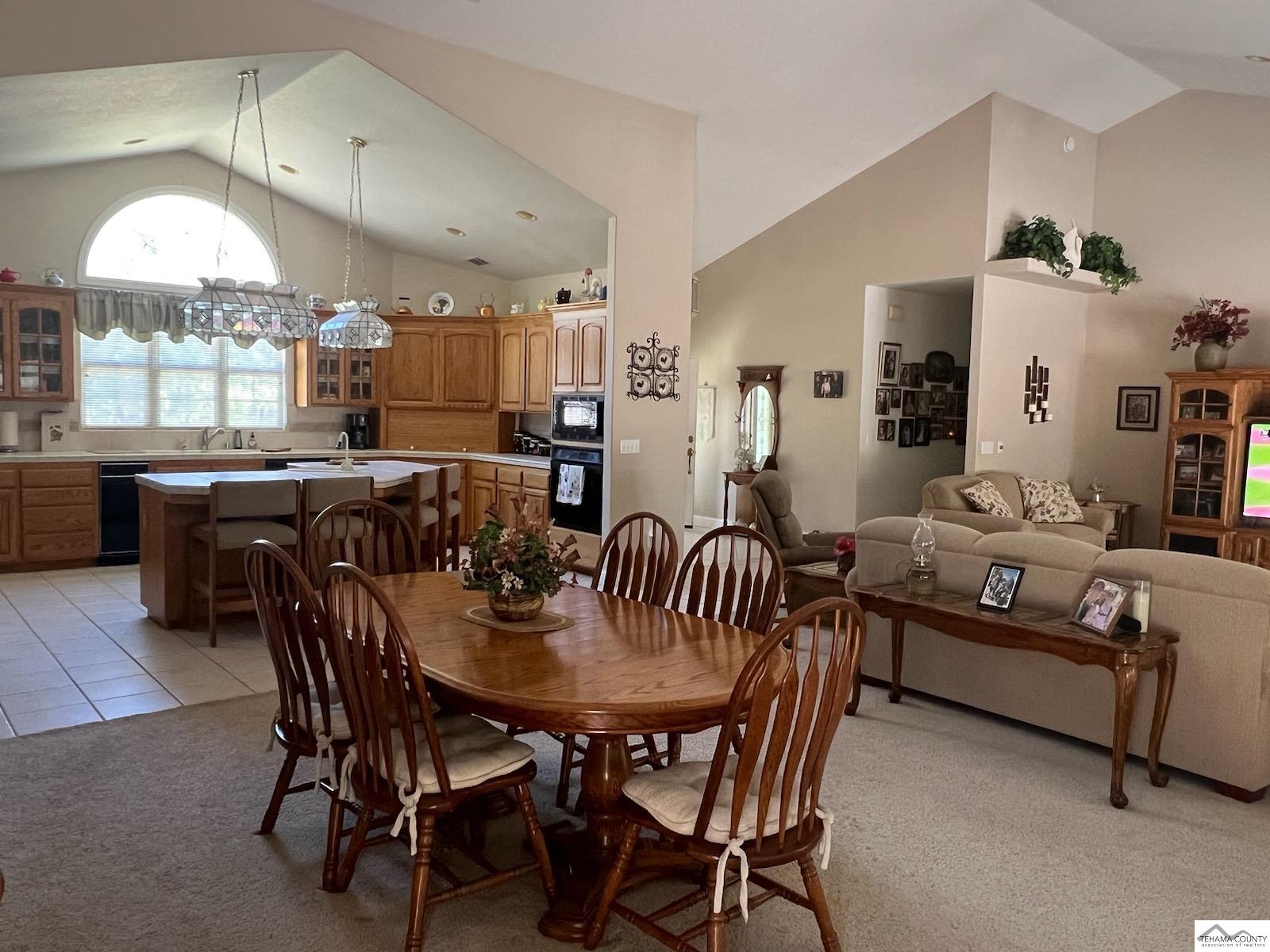 19740 Reeds Creek Road Red Bluff, CA 96080 - Photo 21 of 51 a view of a dining room with furniture and chandelier