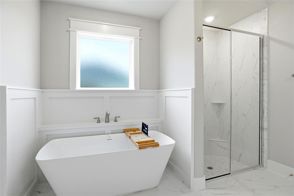 133 Joel Street Springtown, TX 76082 - Photo 8 of 15 a bathroom with a tub and shower