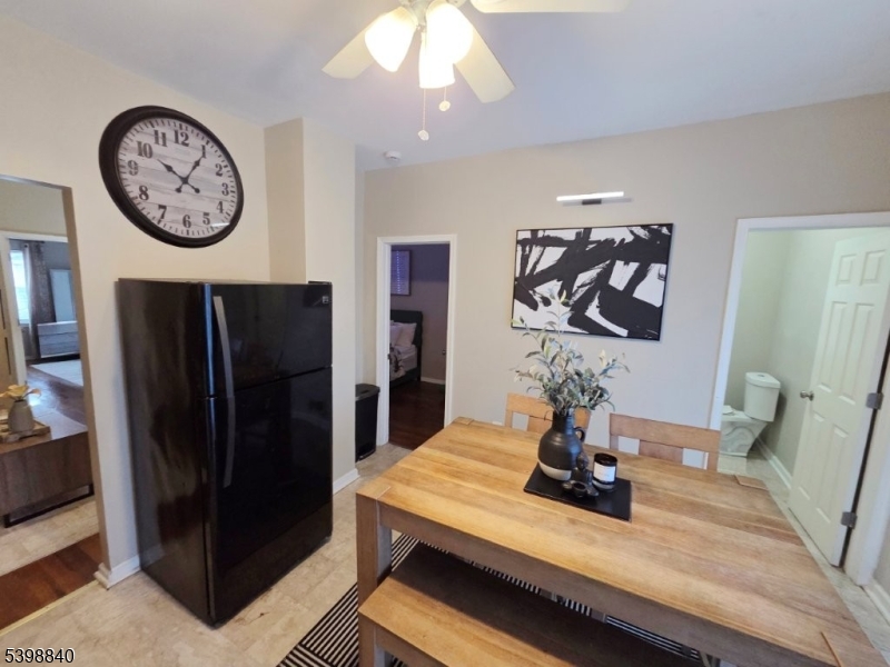 541 Fulton Street Elizabeth Port, NJ 07206 - Photo 11 of 14 a view of a dining room with furniture and wooden floor