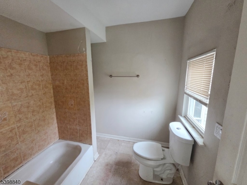541 Fulton Street Elizabeth Port, NJ 07206 - Photo 6 of 14 a bathroom with a toilet and a shower