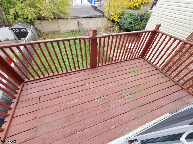 541 Fulton Street Elizabeth Port, NJ 07206 - Photo 7 of 14 a balcony with view of wooden floor