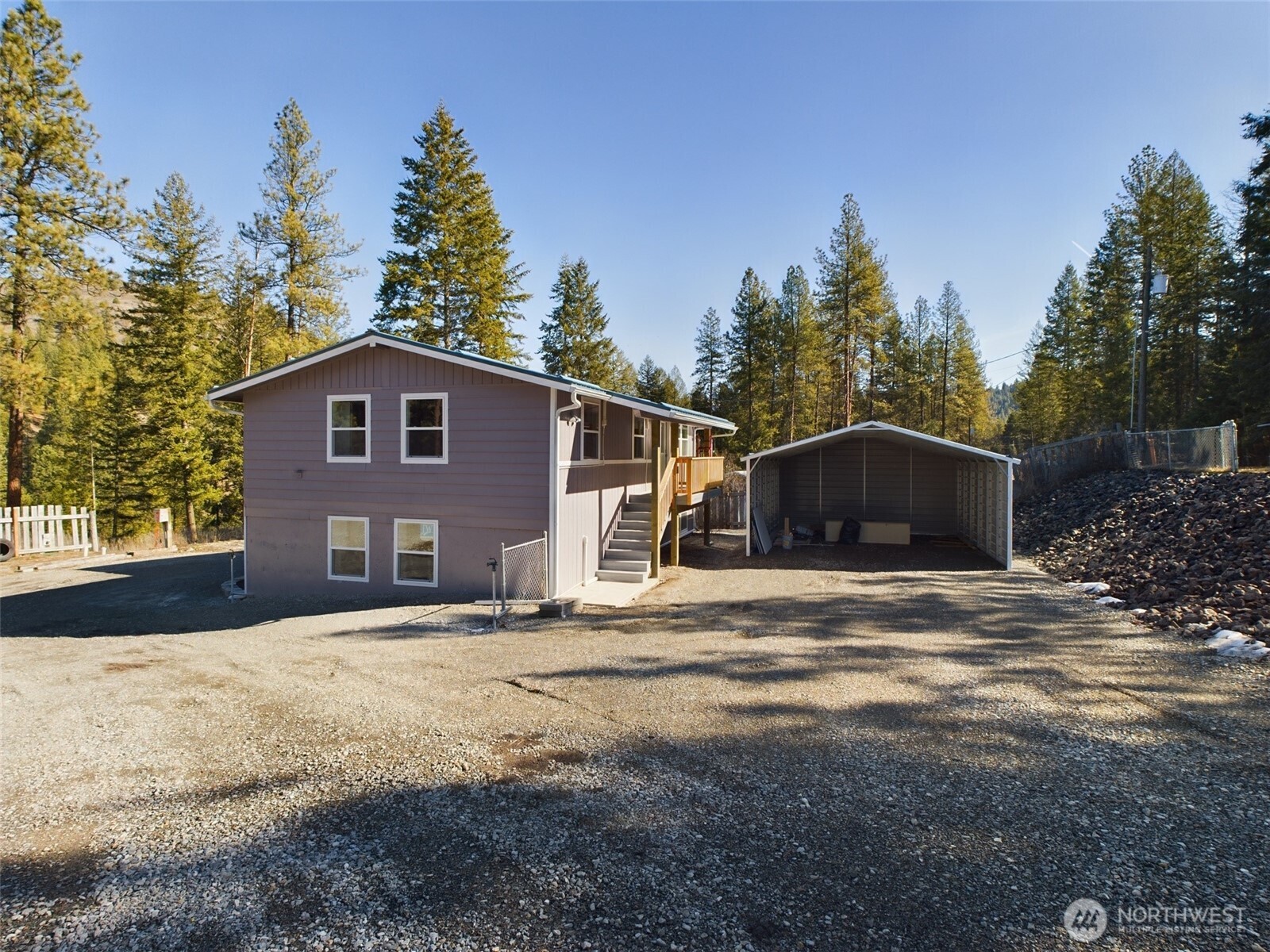 9 Pine Grove Street Republic, WA 99166 - Photo 1 of 13 a front view of a house with a yard