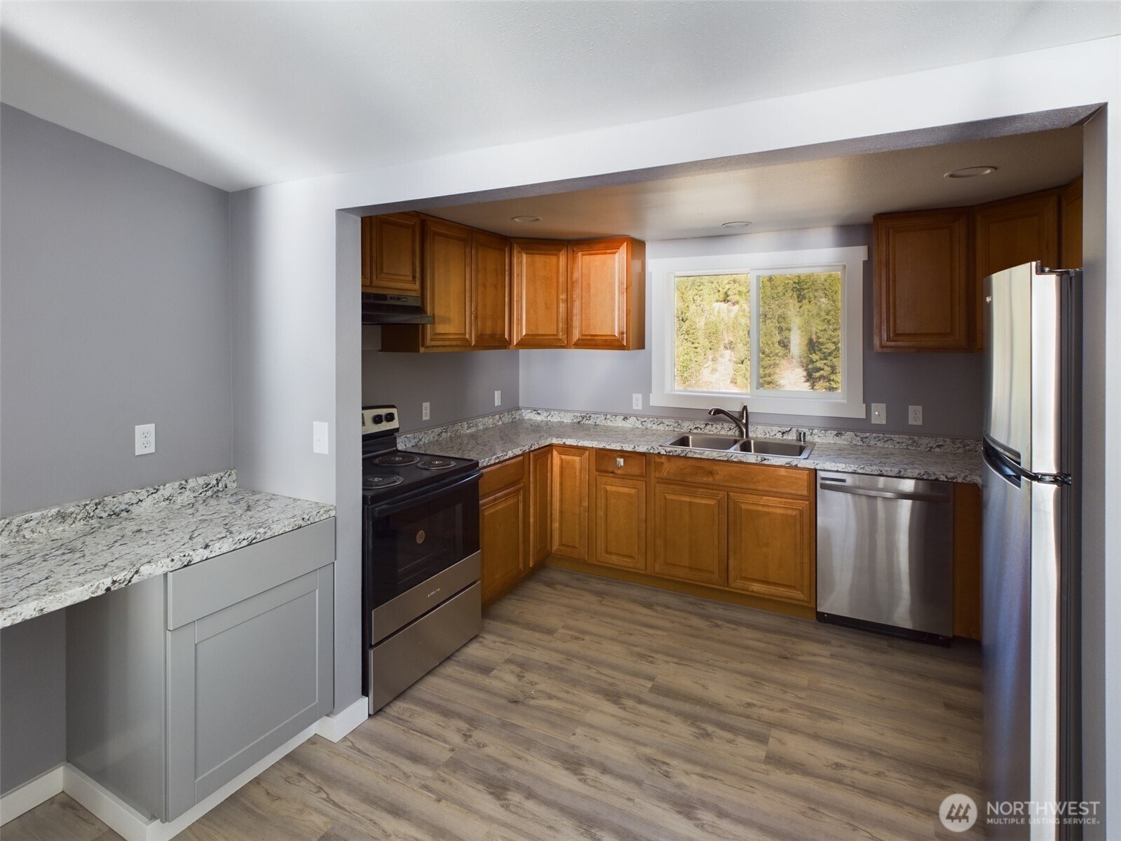 9 Pine Grove Street Republic, WA 99166 - Photo 5 of 13 a kitchen with a sink cabinets and wooden floor