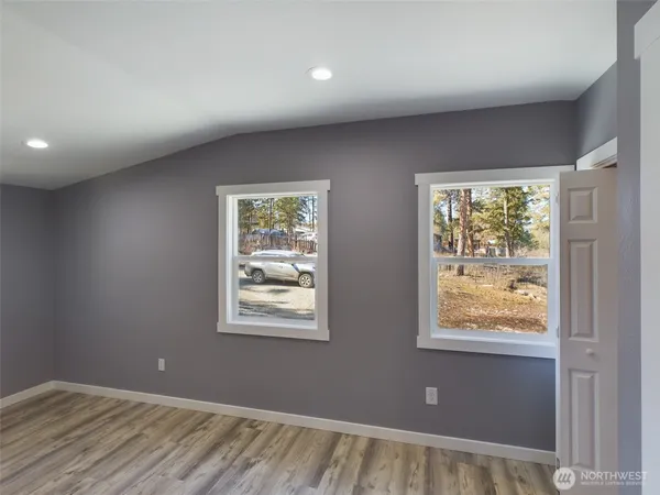 a view of an empty room with a window