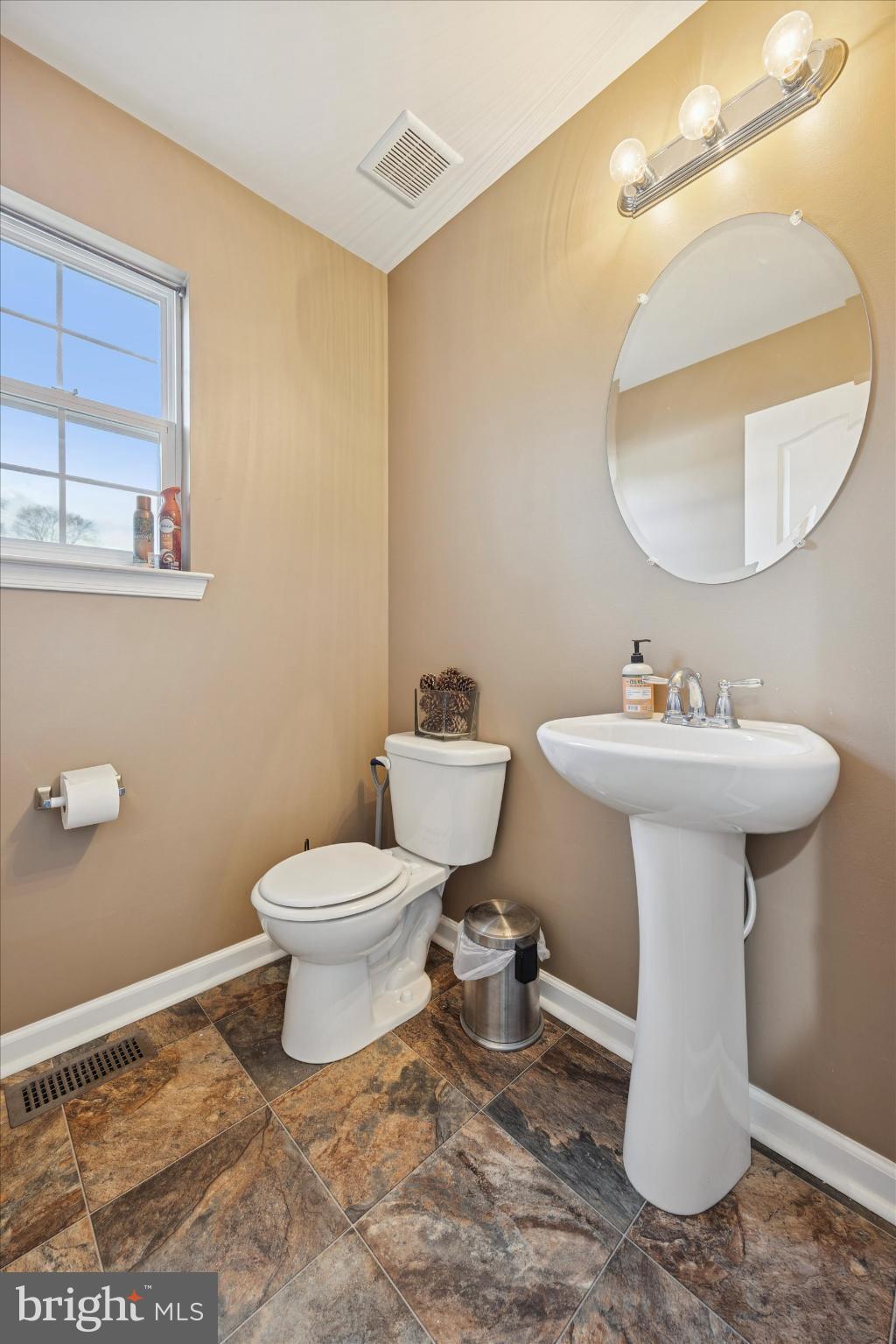 106 Nottingham Lane Newfield, NJ 08344 - Photo 11 of 29 a bathroom with a sink toilet and a mirror