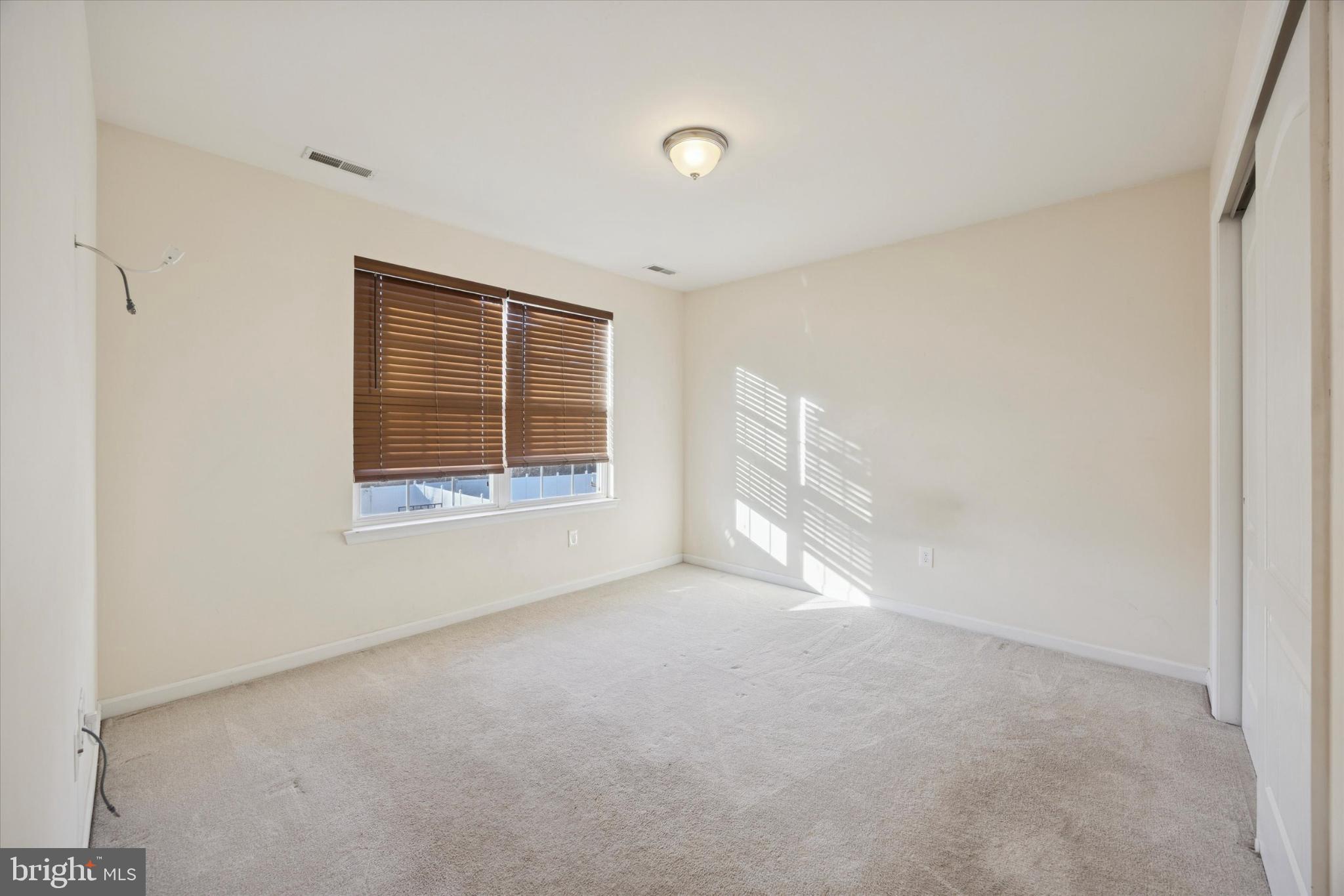 106 Nottingham Lane Newfield, NJ 08344 - Photo 12 of 29 a view of empty room with window