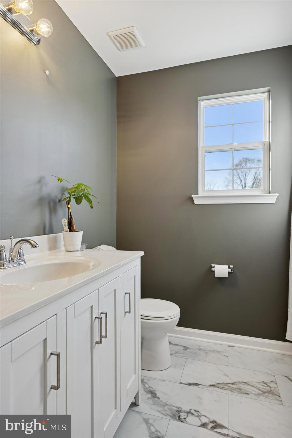106 Nottingham Lane Newfield, NJ 08344 - Photo 17 of 29 a bathroom with a toilet sink and mirror