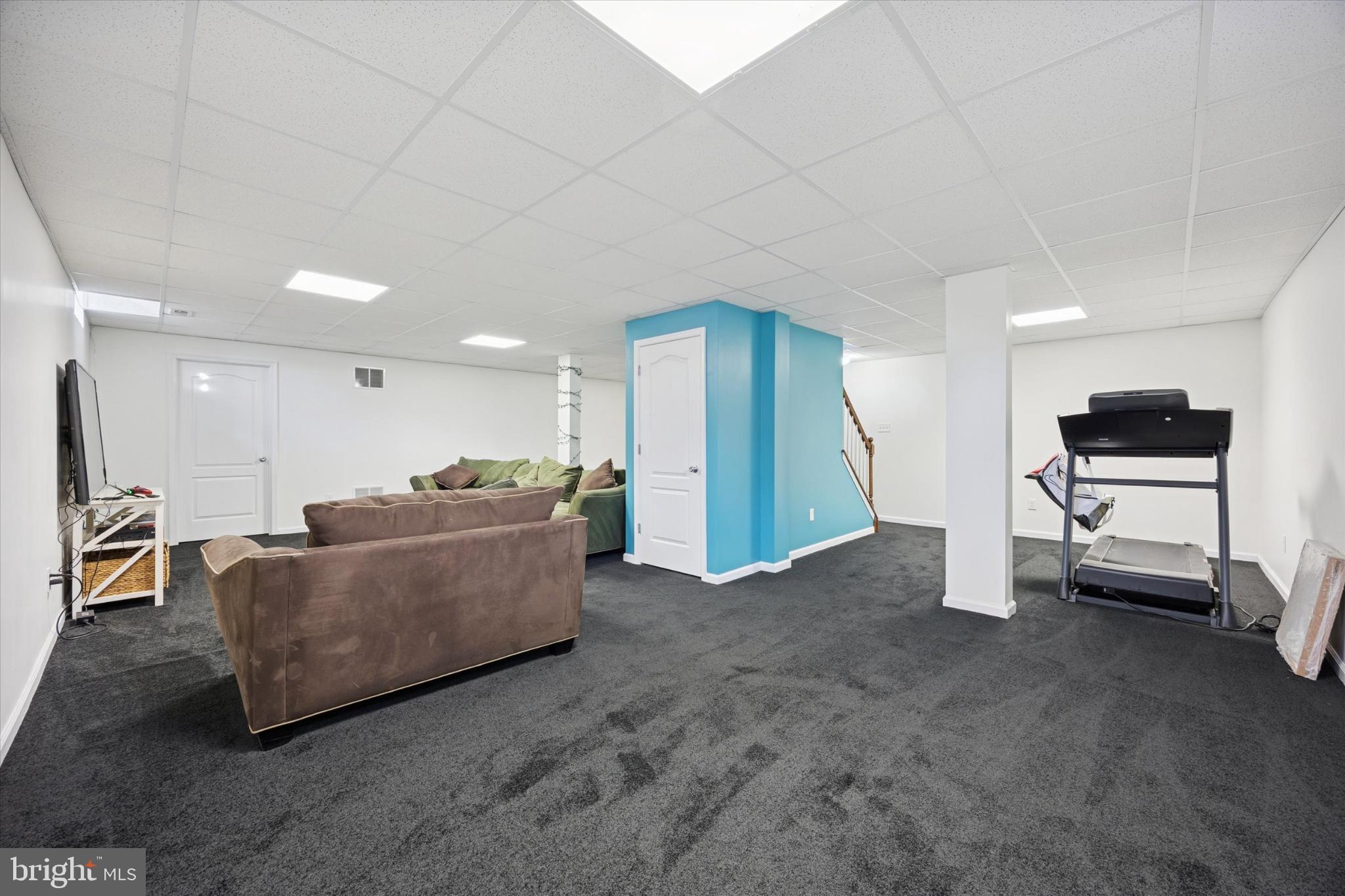 106 Nottingham Lane Newfield, NJ 08344 - Photo 21 of 29 a living room with furniture and a flat screen tv