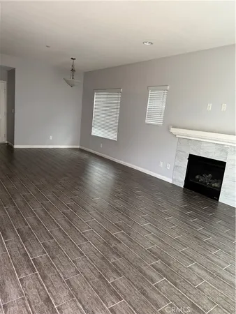 a view of a livingroom with wooden floor