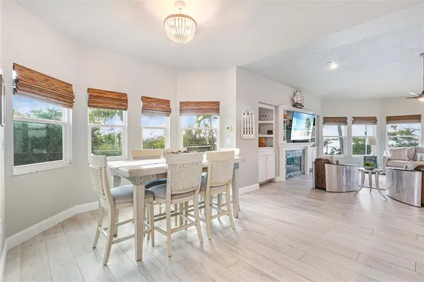 a kitchen with white cabinets and appliances