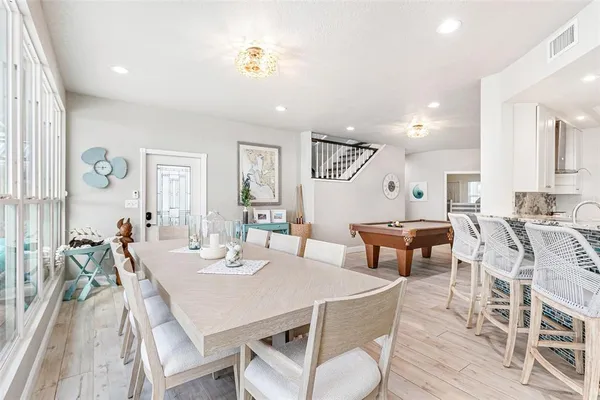 a kitchen with stainless steel appliances a refrigerator sink and cabinets