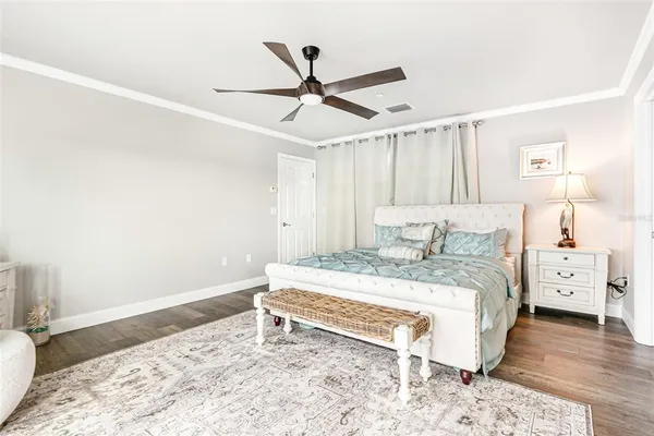 a bathroom with a toilet sink vanity and mirror