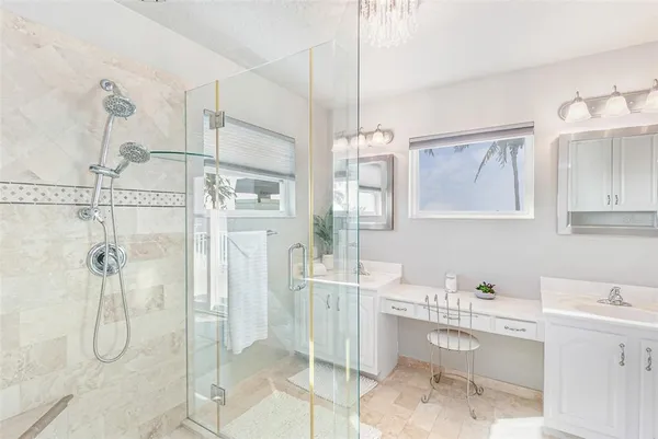 a bedroom with a bed and ceiling fan