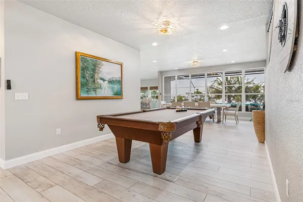 an aerial view of a house with garden space and street view