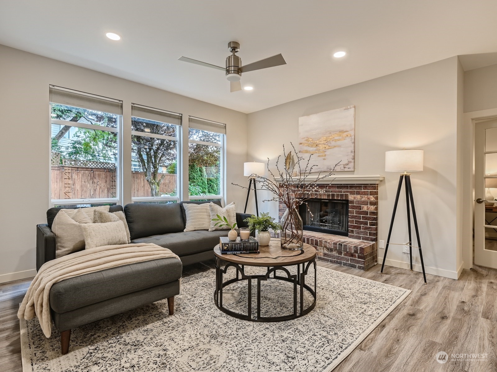 11216 39th Drive Southeast Everett, WA 98208 - Photo 16 of 40 a living room with furniture a fireplace and a table