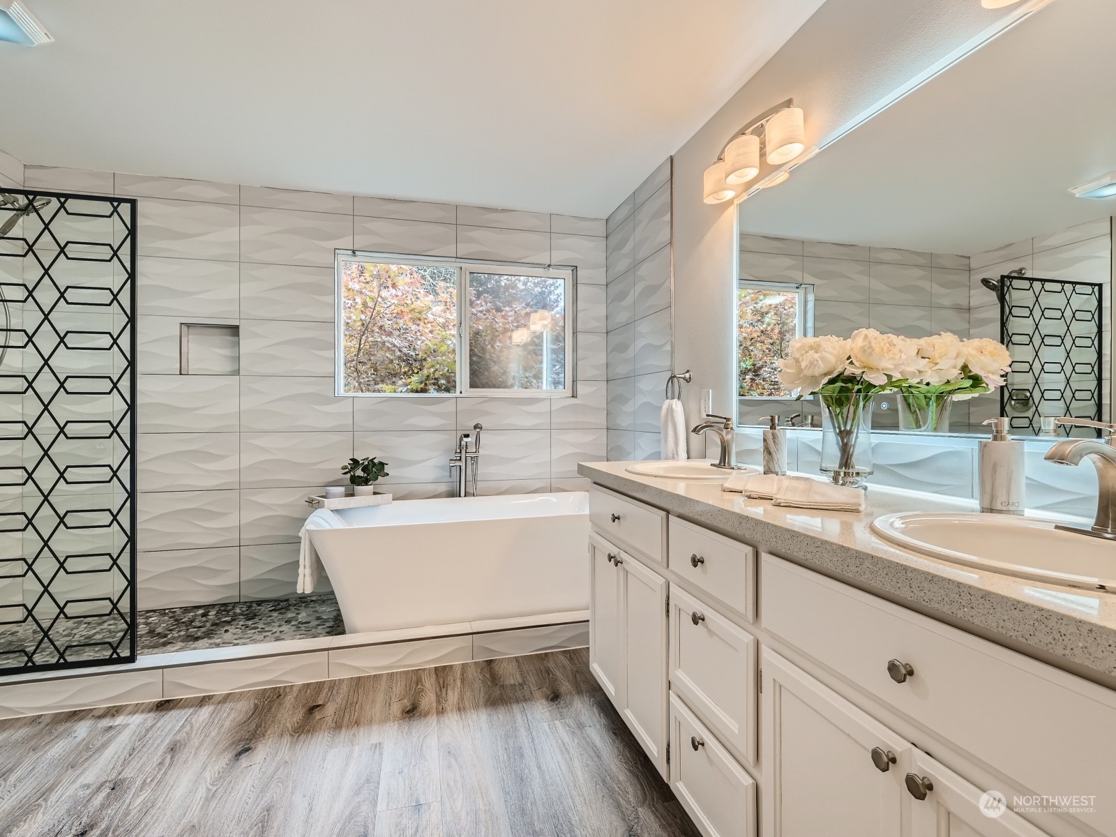 11216 39th Drive Southeast Everett, WA 98208 - Photo 21 of 40 a spacious bathroom with a granite countertop sink mirror and a bathtub